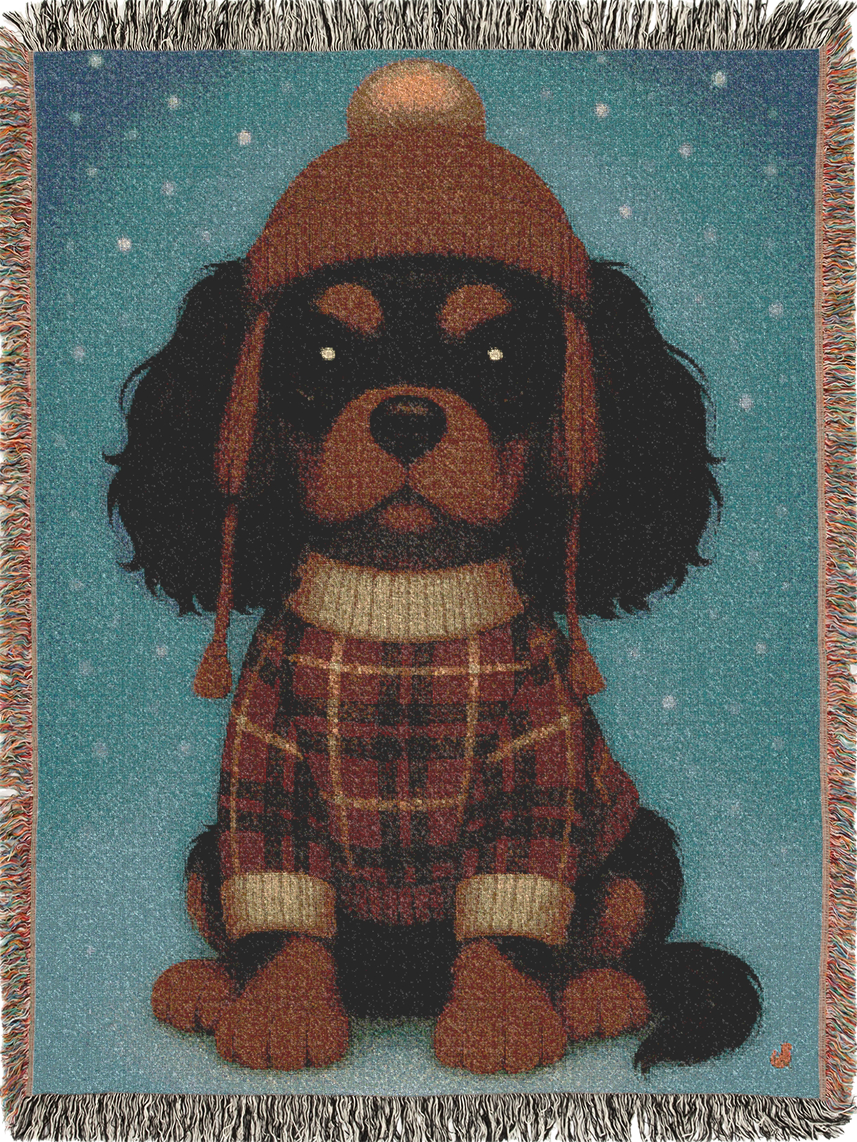 Cavy Comfort woven throw blanket, front view with fringed edges, Black and Tan Cavalier King Charles Spaniel puppy in a knit beanie and sweater in the snow